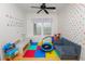 Playful ' room features colorful walls, a mini trampoline, and built-in storage at 9713 Royce Dr, Tampa, FL 33626