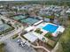 Aerial view of community pool, tennis courts, and clubhouse at 9713 Royce Dr, Tampa, FL 33626