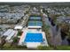 Community pool and tennis courts with surrounding neighborhood at 9713 Royce Dr, Tampa, FL 33626