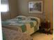 Cozy bedroom with a comfortable bed and a dresser at 14900 Gulf Blvd # 113, Madeira Beach, FL 33708