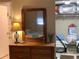 Bedroom with dresser, mirror, and ample closet space at 14900 Gulf Blvd # 113, Madeira Beach, FL 33708