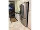 Stainless steel refrigerator in updated kitchen at 14900 Gulf Blvd # 113, Madeira Beach, FL 33708
