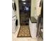 Convenient laundry room with washer, dryer, and storage at 14900 Gulf Blvd # 113, Madeira Beach, FL 33708