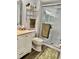 Clean bathroom with a walk-in shower and updated vanity at 936 Virginia St # 208, Dunedin, FL 34698