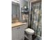 Neat bathroom with a shower/tub combo and a single sink vanity at 936 Virginia St # 208, Dunedin, FL 34698
