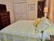 Bright bedroom with a comfortable queen-size bed and ample closet space at 936 Virginia St # 208, Dunedin, FL 34698