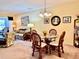 Dining area features a round glass table with four chairs at 936 Virginia St # 208, Dunedin, FL 34698