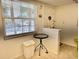 Entryway with a small table, trash can, and view to a window at 936 Virginia St # 208, Dunedin, FL 34698