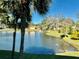Peaceful lake view with lush landscaping and mature trees at 936 Virginia St # 208, Dunedin, FL 34698