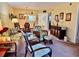 Bright and airy living room with a dining area and wicker furniture at 936 Virginia St # 208, Dunedin, FL 34698