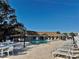 Inviting pool area with lounge chairs and patio tables at 936 Virginia St # 208, Dunedin, FL 34698