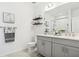 Modern bathroom with double sink vanity, marble countertop, neutral color palette, and stylish decor at 11658 Bluestone Ct, Parrish, FL 34219