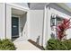 Charming front entrance with a decorative welcome sign and landscaped garden bed at 11658 Bluestone Ct, Parrish, FL 34219