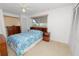 Bright bedroom with built-in headboard shelving, dresser, and natural light from the window at 2167 Timber Ln, Clearwater, FL 33763