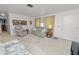 Inviting living room featuring plush carpet, neutral walls, and comfortable seating at 2167 Timber Ln, Clearwater, FL 33763