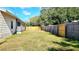 Expansive backyard featuring a well-maintained lawn and secure wooden fencing at 2954 37Th N Ave, St Petersburg, FL 33713