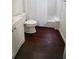 Bathroom with modern vanity, toilet, shower/tub combo and dark tile floor at 2954 37Th N Ave, St Petersburg, FL 33713