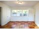 Bright bedroom with natural light, featuring checkerboard tile floors and neutral walls at 2954 37Th N Ave, St Petersburg, FL 33713