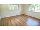 Cozy bedroom featuring wood floors and dual windows, perfect for relaxation and comfort at 2954 37Th N Ave, St Petersburg, FL 33713