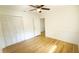 Cozy bedroom with hardwood floors, neutral walls, and a ceiling fan at 2954 37Th N Ave, St Petersburg, FL 33713