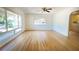 Inviting living room boasting hardwood floors, a ceiling fan, and abundant natural light from large windows at 2954 37Th N Ave, St Petersburg, FL 33713