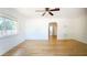 Living room with hardwood floors, a ceiling fan, and an archway providing a view to the other rooms at 2954 37Th N Ave, St Petersburg, FL 33713