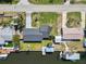 Aerial view of property with a boat dock on canal, situated on a well-maintained lot at 3215 W Shell Point Rd, Ruskin, FL 33570