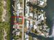 Aerial view of home in neighborhood located on the canal near the intercoastal at 3215 W Shell Point Rd, Ruskin, FL 33570