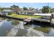 Backyard of waterfront property featuring a new dock and boat lift at 3215 W Shell Point Rd, Ruskin, FL 33570