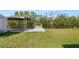 Waterfront property featuring a wooden dock and boat lift area at 3215 W Shell Point Rd, Ruskin, FL 33570