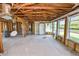 Bright living room featuring unfinished walls and ceiling with many windows at 3215 W Shell Point Rd, Ruskin, FL 33570