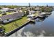 Waterfront home featuring a dock and boat lift, perfect for enjoying canal living at 3215 W Shell Point Rd, Ruskin, FL 33570