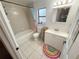 Bathroom with a shower-tub, toilet, and white vanity at 3415 Phillips St, Tampa, FL 33619