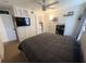 Bedroom featuring a large bed and lots of wall decor at 3415 Phillips St, Tampa, FL 33619