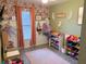 Whimsical bedroom with hardwood floors, ample natural light, and dedicated toy storage at 3415 Phillips St, Tampa, FL 33619