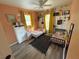 Bright bedroom featuring floral wallpaper, two beds, and warm-toned walls at 3415 Phillips St, Tampa, FL 33619