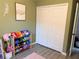 Bright bedroom with a large closet, hardwood floors and toy storage at 3415 Phillips St, Tampa, FL 33619