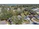 This aerial view highlights a home nestled in a quiet neighborhood with mature trees and private backyard at 530 Napa Valley Cir, Valrico, FL 33594