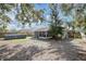 Backyard with an above-ground pool and screened lanai, ideal for relaxation and outdoor enjoyment at 530 Napa Valley Cir, Valrico, FL 33594