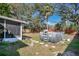 Spacious backyard featuring a screened lanai and an above-ground pool, perfect for summer fun and relaxation at 530 Napa Valley Cir, Valrico, FL 33594