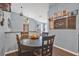 Dining area with hardwood floors, pendant lighting, and wall decor at 530 Napa Valley Cir, Valrico, FL 33594