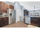 Well equipped kitchen featuring stainless steel appliances and dark wood cabinets at 530 Napa Valley Cir, Valrico, FL 33594