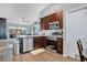 Modern kitchen with stainless steel appliances and dark wood cabinetry at 530 Napa Valley Cir, Valrico, FL 33594