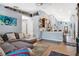 Open living area with hardwood floors that leads to the kitchen with bar seating at 530 Napa Valley Cir, Valrico, FL 33594