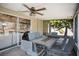 Cozy screened patio area with ceiling fan and sliding door access, perfect for outdoor entertaining at 530 Napa Valley Cir, Valrico, FL 33594