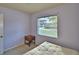 This bedroom has light purple walls and includes a futon at 1413 May St, Lutz, FL 33548