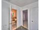 Hallway view of the house leading to a bathroom and a bedroom at 1413 May St, Lutz, FL 33548