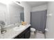 Bathroom showcasing a vanity with a granite countertop, a sink and a mirror at 8680 Falling Blue Pl, Riverview, FL 33578