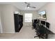 Home office with desk setups, ceiling fan and natural light from the window at 8680 Falling Blue Pl, Riverview, FL 33578