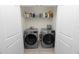 Laundry room showcasing a washer and dryer behind closet doors at 8680 Falling Blue Pl, Riverview, FL 33578